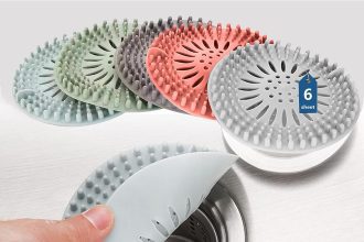 Durable silicone hair catcher for shower drain, preventing clogs and hair buildup.