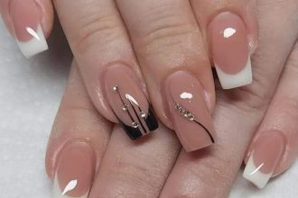 A set of gradient white false nails displayed on a white surface. Each nail features a gradient design fading from white to translucent.